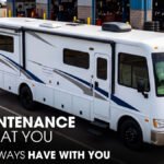 A Class A Motorhome Parked Outside of a RV Repair Shop for Maintenance Works
