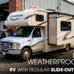 A Class C Motorhome outside of a workshop, showing it's Slide-Out
