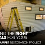 A Vintage Camper Parked inside a Workshop for Restoration Works