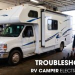 An RV Camper parked inside a Workshop for Electrical Repair Works