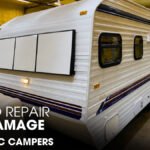 A Classic Camper Trailer parked inside a Workshop for Repair Works