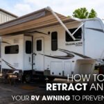 A Trail Blazer 5th Wheel RV parked outside of a Workshop for Awning Repair Works.