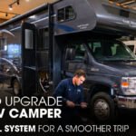 A Technician Repairing An RV Camper inside A Workshop