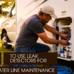 Man fixing camper water system panel outdoors