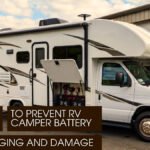 A white Class C motorhome with an open battery compartment