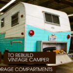 A Vintage Camper inside an workshop showing it's bumper storage compartment