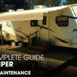 A Palomino Puma Camper trailer parked on a deck showing it's Awning