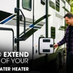 A Male Technician Inspecting A Camper's Water Heater
