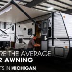 A Male Technician Checking A Jayco Camper's Awning inside A Workshop