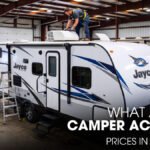 A Male Technician Repairing the AC Unit of a Jayco Camper inside a Workshop