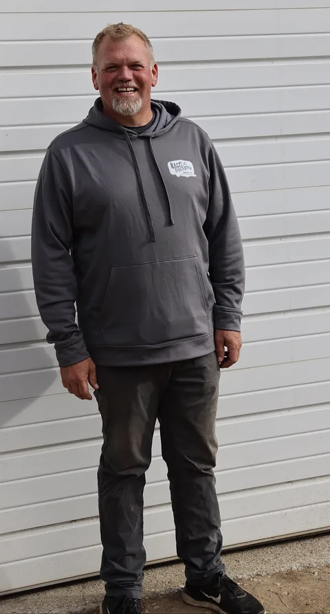 Ben Nagel, owner and state-certified mechanic at Nagel Trailer Repair in Merrill, Michigan, in his shop hoodie