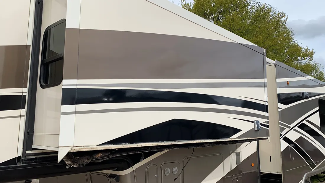 Fifth wheel slide-out floor rotted through by water damage, opened up for a rot restoration at Nagel Trailer Repair in Merrill, Michigan